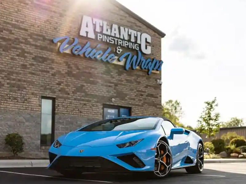 Blue Lamborghini with paint protection film parked outside Atlantic Custom Wraps in North Carolina