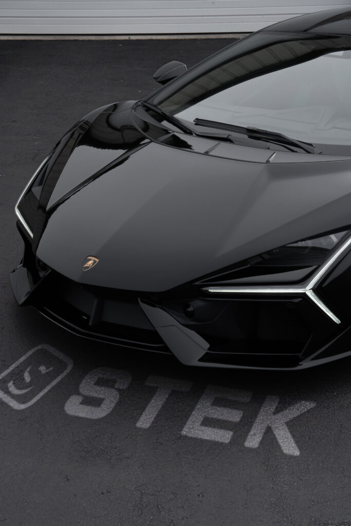 Paint protection film on the black hood and front end of a Lamborghini at Atlantic Custom Wraps in NC