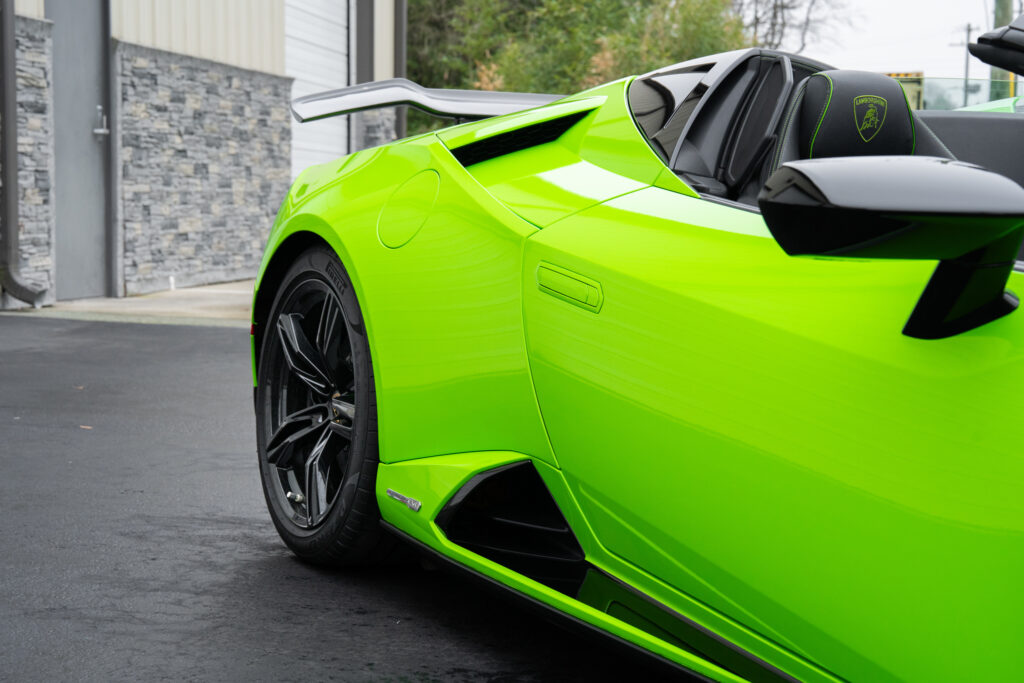 Close-up of a lime-green sports car featuring vinyl car wraps by Atlantic Custom Wraps in NC