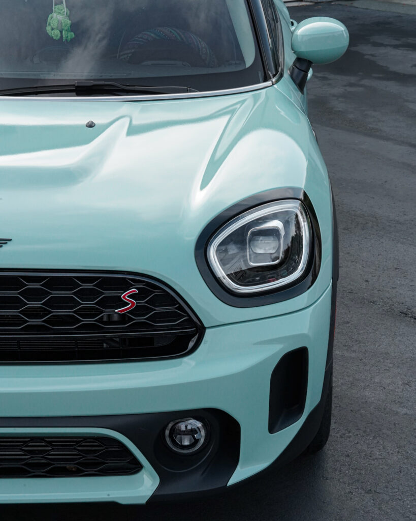 Mint green Mini Cooper with vinyl car wrap on the hood and front panels by Atlantic Custom Wraps in NC