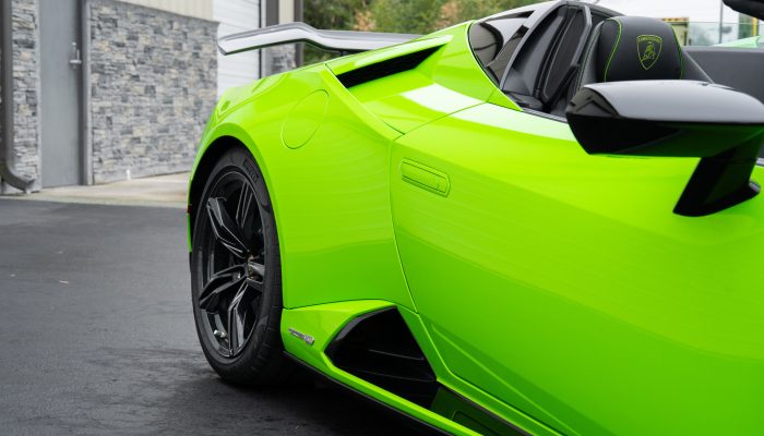 Close-up of a lime-green sports car featuring vinyl car wraps by Atlantic Custom Wraps in NC