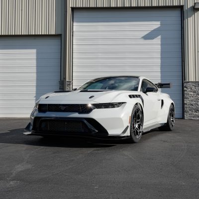 Week showcases a low white performance coupe with black detailing outside Atlantic Custom Wraps in NC.